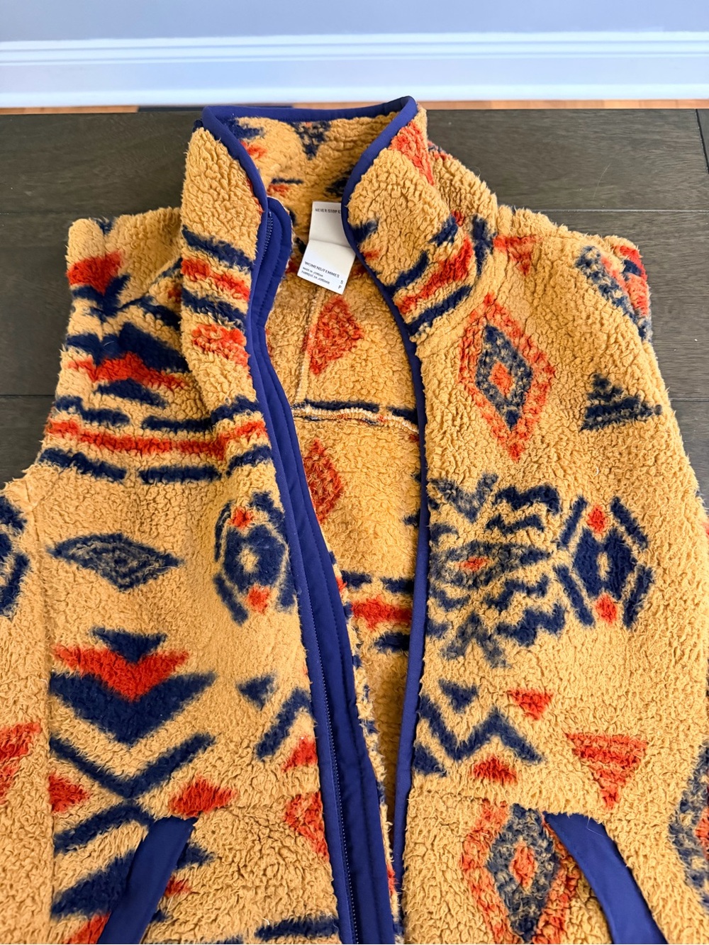 The North Face Kids Mustard Sherpa Vest with Navy & Orange Pattern